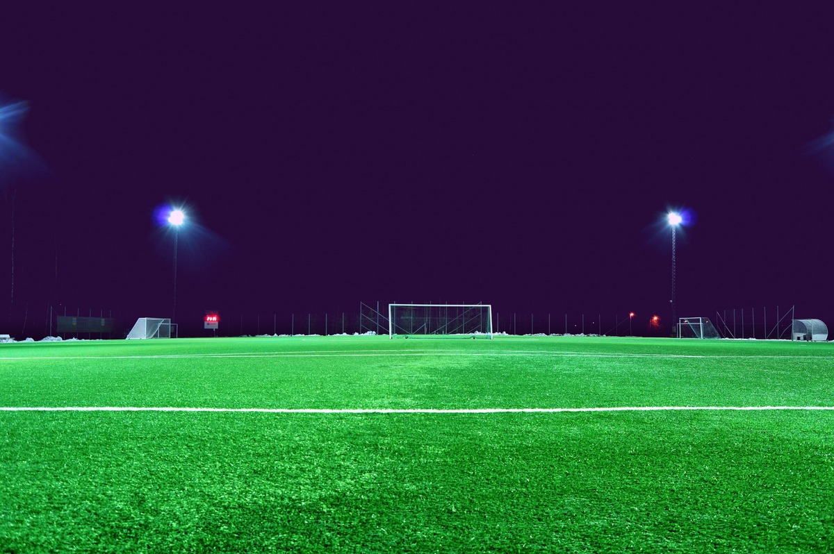 An empty soccer pitch at night